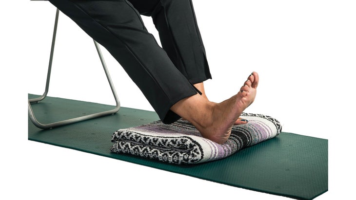 Close-up of flexed foot on a blanket