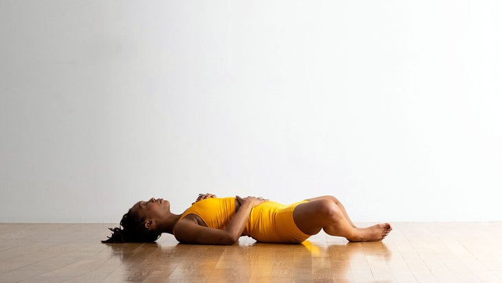 Woman in Reclining Bound Angle Pose