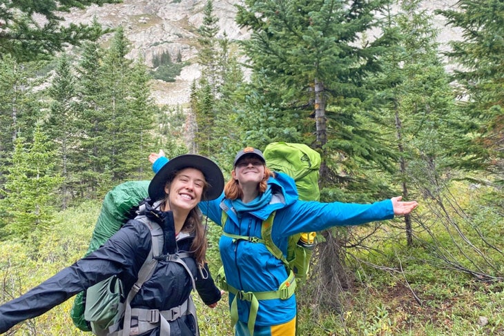 Two women backpacking in the backcountry