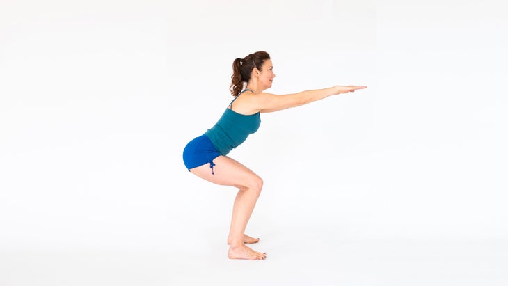 A woman demonstrates Malasana, variation (Garland Pose)