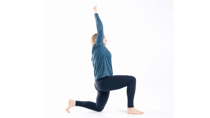 A woman demonstrates a side bend