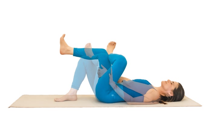 Woman demonstrating eye-of-the-needle pose