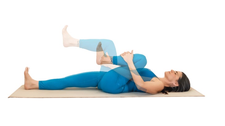Woman demonstrating half-knees-to-chest pose