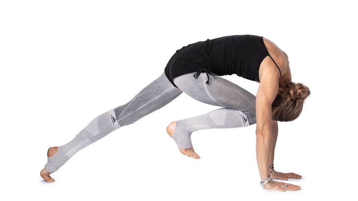 Woman practices Knee-to-Nose