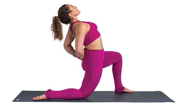 Woman in low lunge with hands behind back