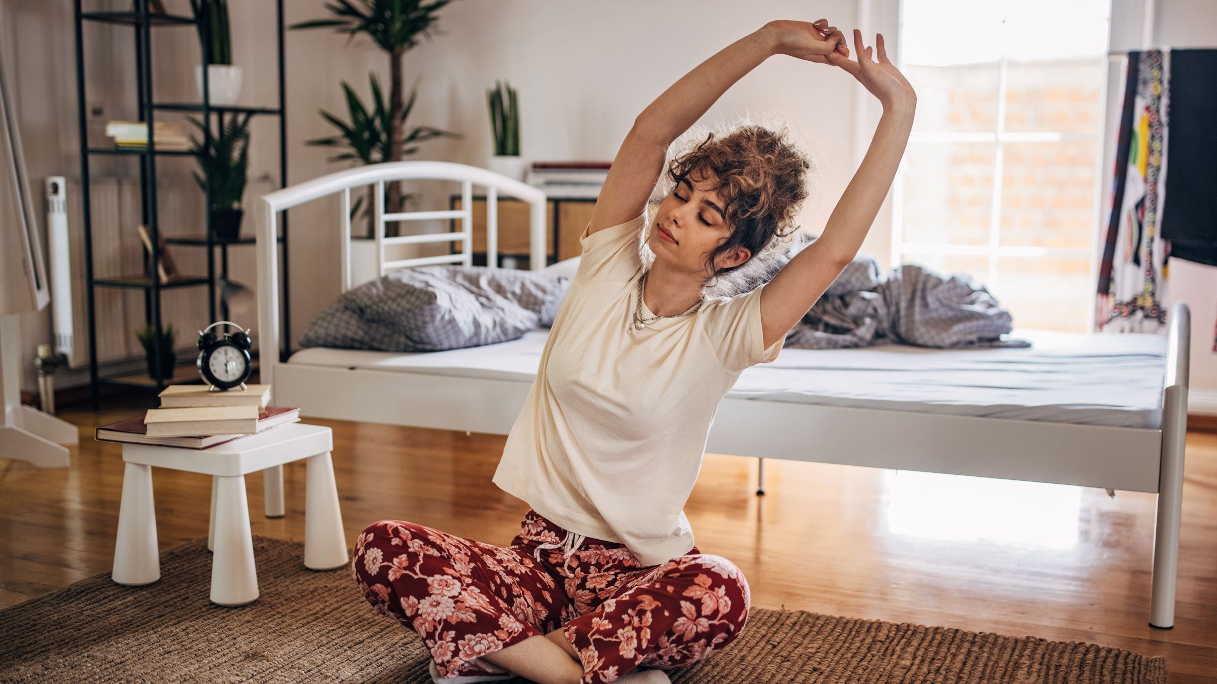 Woman does morning yoga stretches
