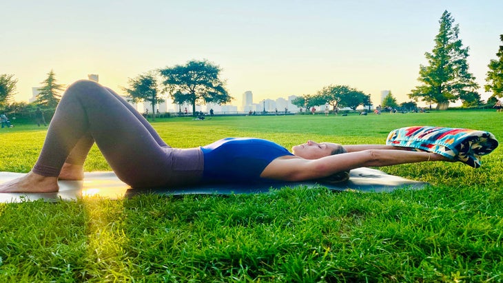 woman lying on mat