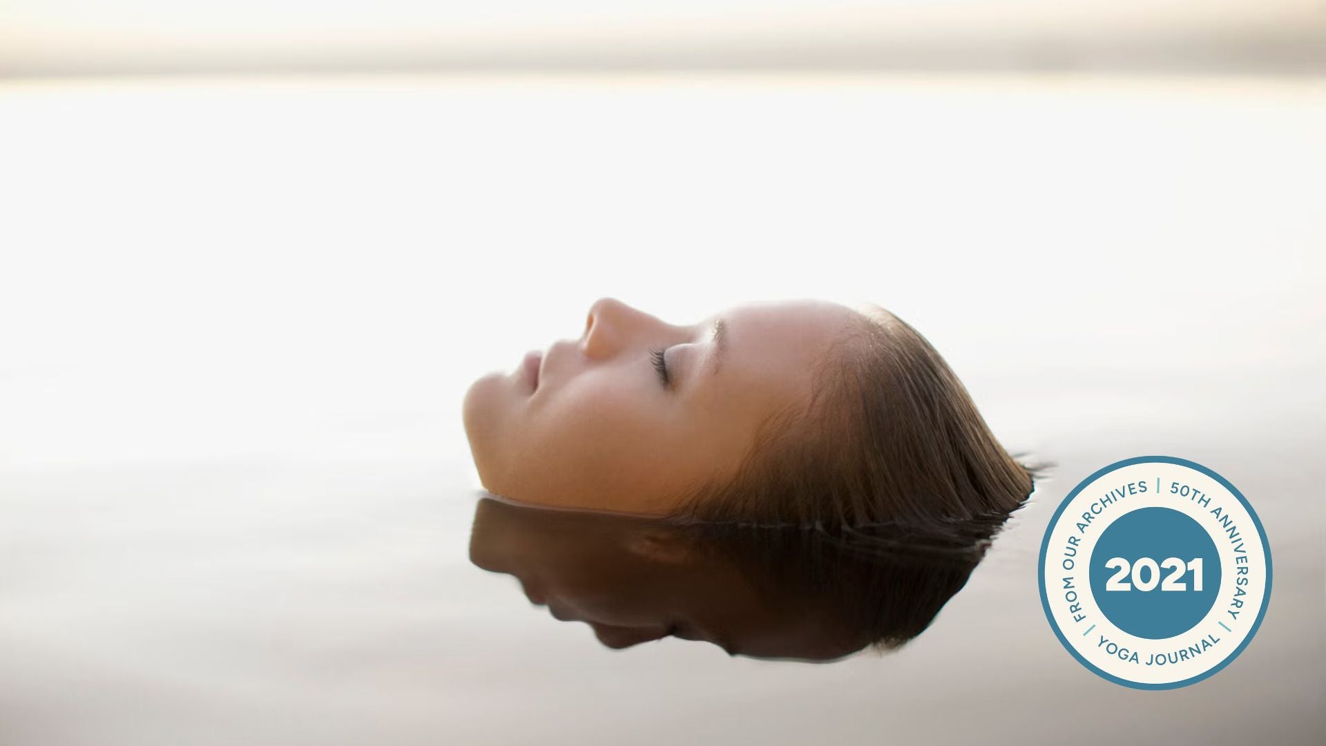 Woman floating in water.