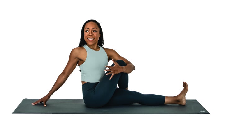 Woman in Lord of the Fishes Pose