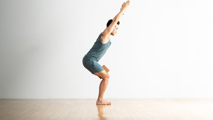 Man in a Chair Pose modification with a block
