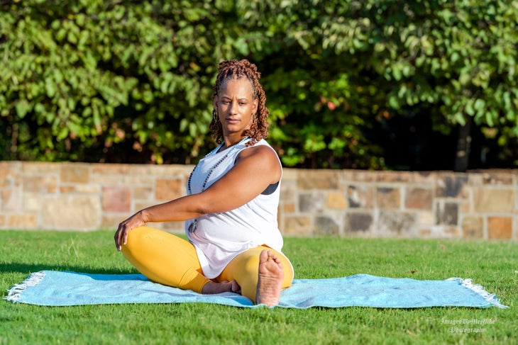 Kiesha Battles doing yin yoga deer pose