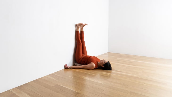 Woman in Supported Legs-Up-the-Wall Pose