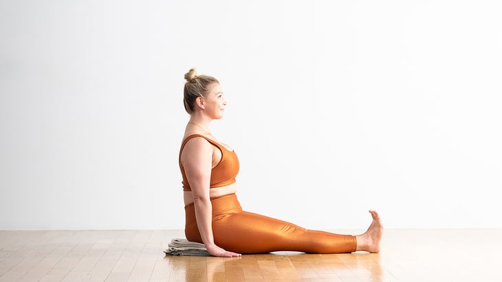 Woman in Staff Pose variation with support