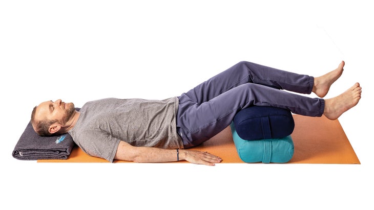 Jivana Heyman showing a modified legs-up-the-wall pose