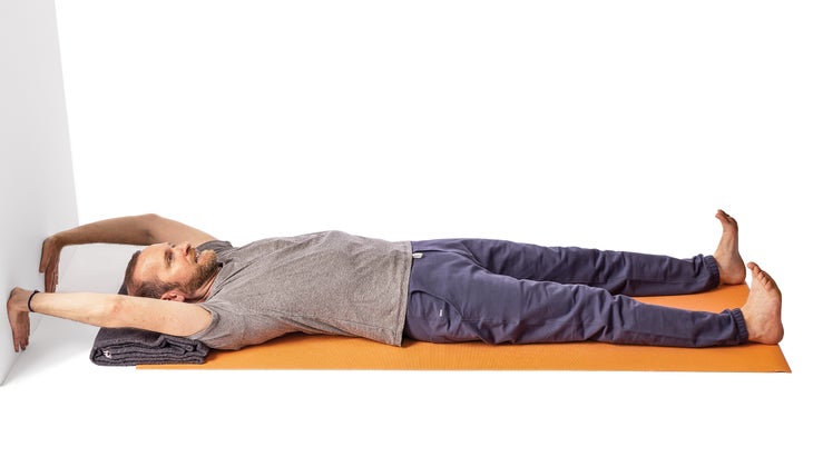 Jivana Heyman demonstrating a reclined handstand