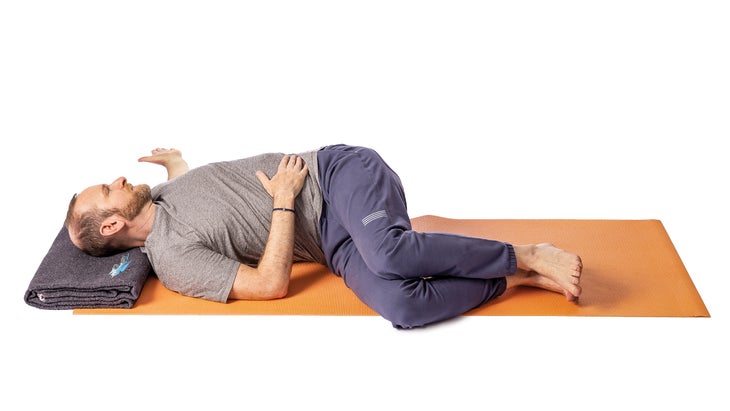 Jivana Heyman in a revolved abdomen pose variation