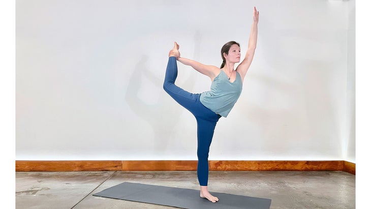 A person demonstrates Natarajasana (Lord of the Dance or Dancer Pose) in yoga