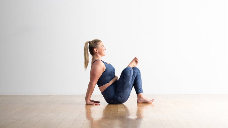 Woman demonstrating One-Legged King Pigeon Pose