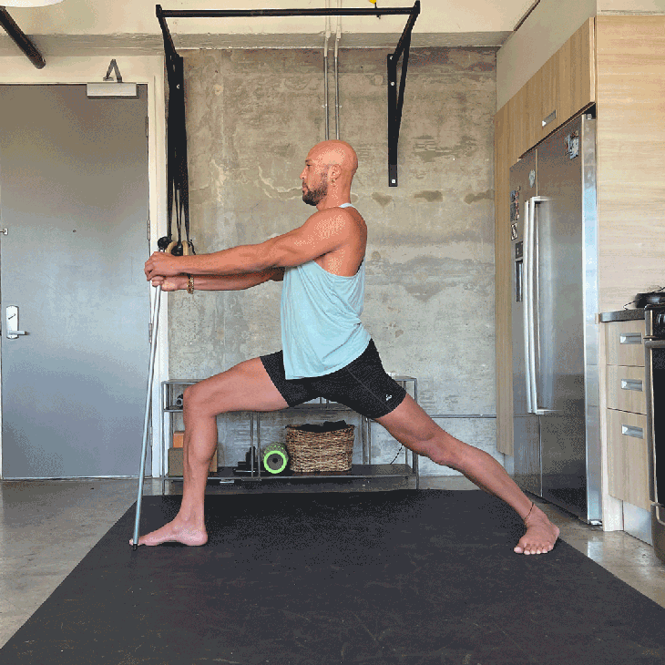 Rocky Heron in Virabhadrasana stick stir variation