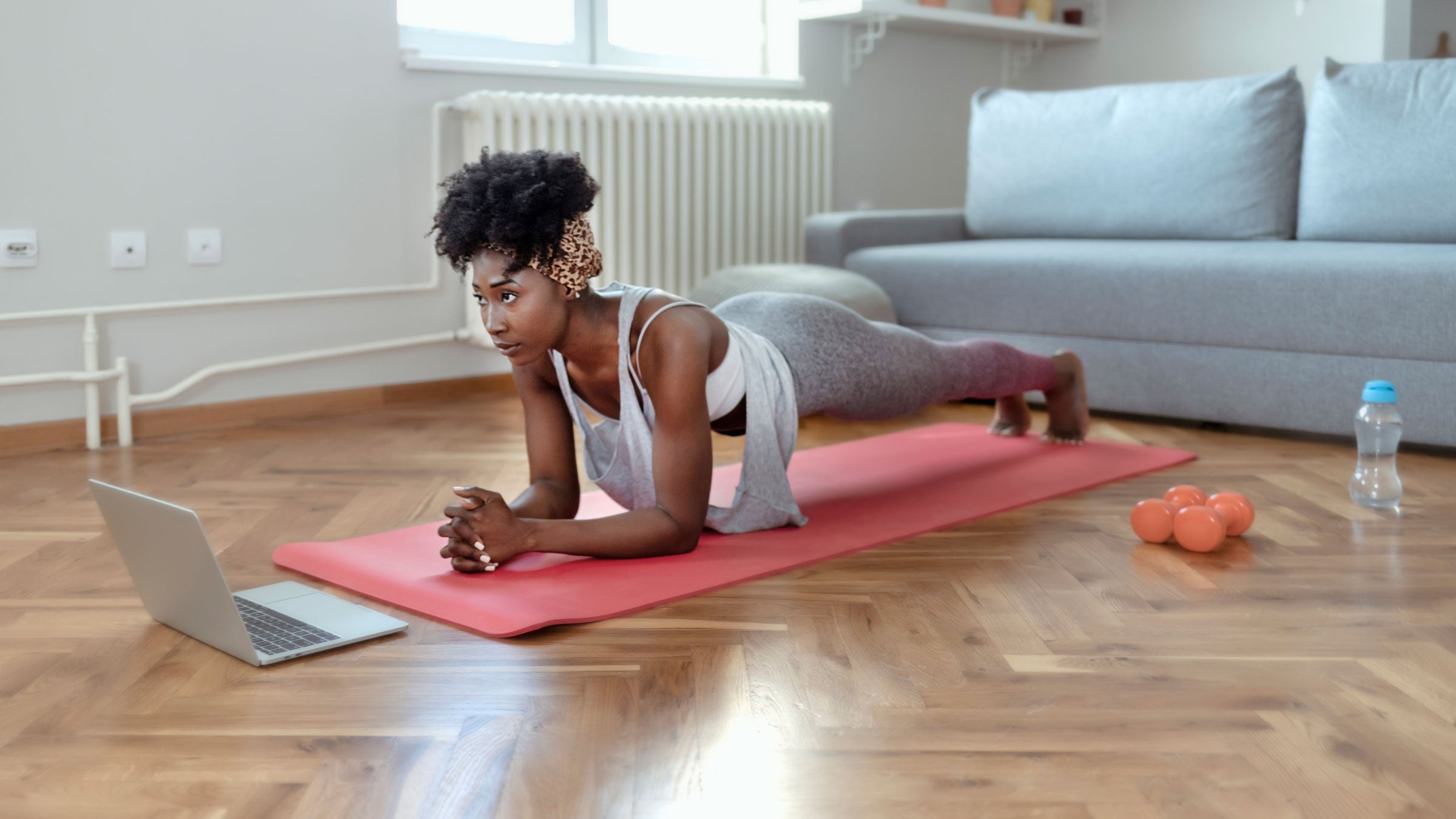 Woman practices Plank Pose