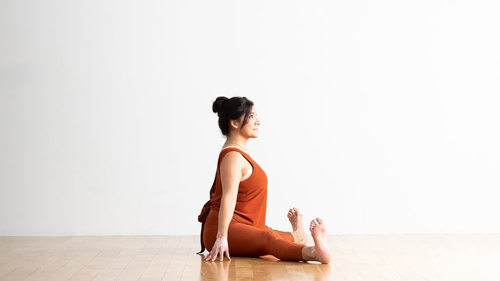 Woman demonstrates Wide-Legged Seated Forward Fold