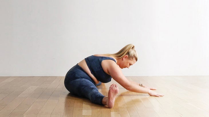 Woman in a Wide-Angled Seated Forward Bend