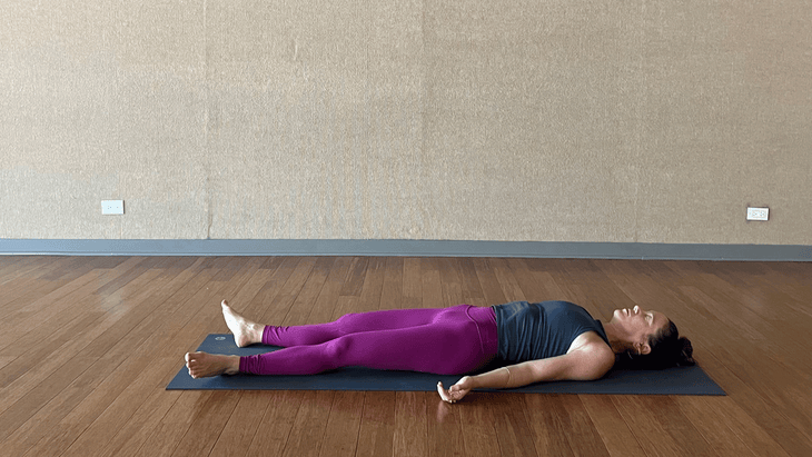 Woman resting after Crow Pose