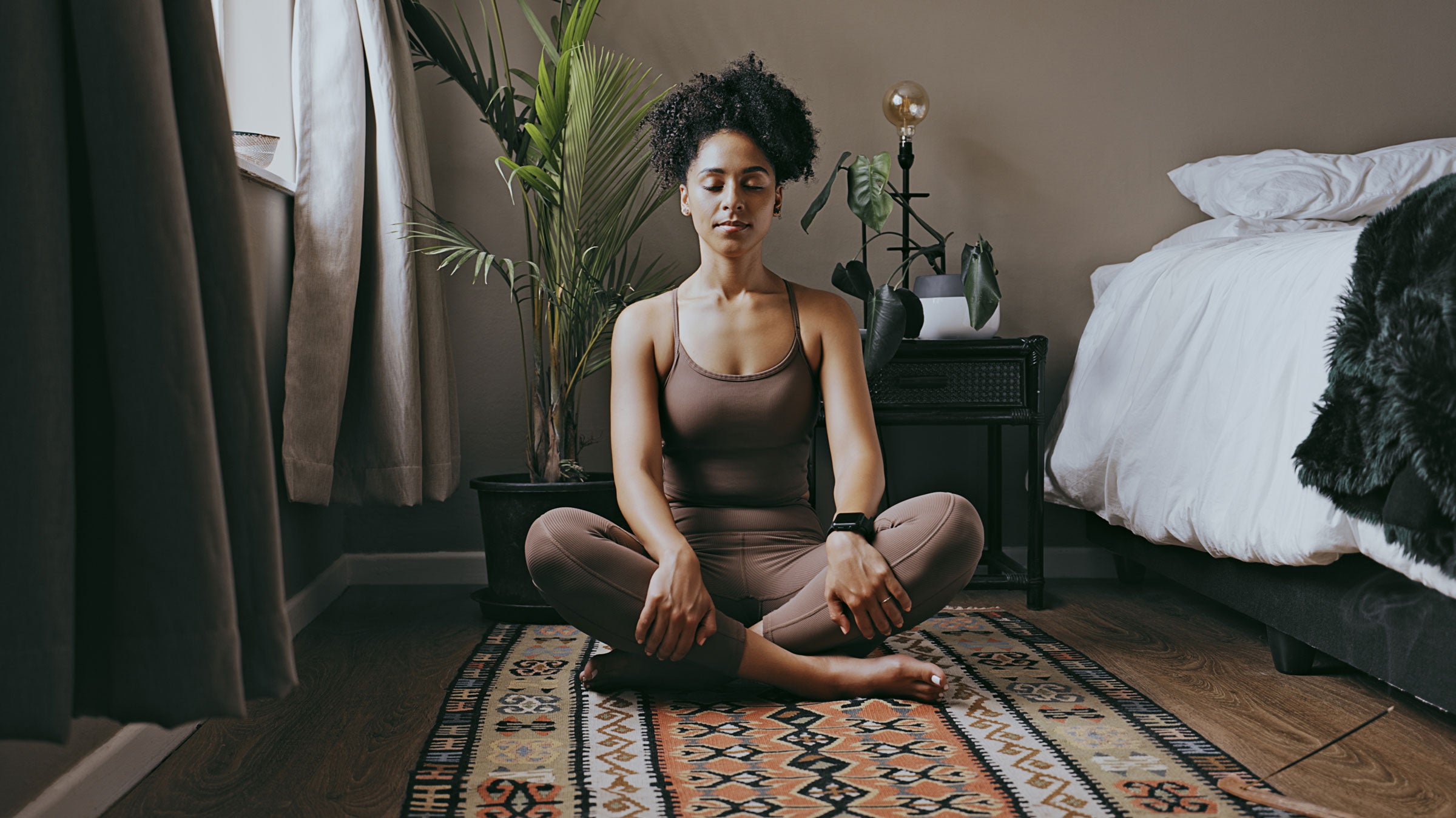 Woman meditates at home