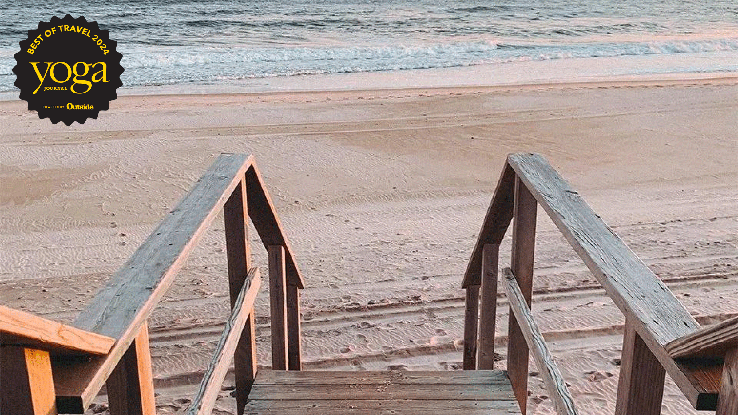 Photograph of wood stairs from a resort onto the beach at Montauk