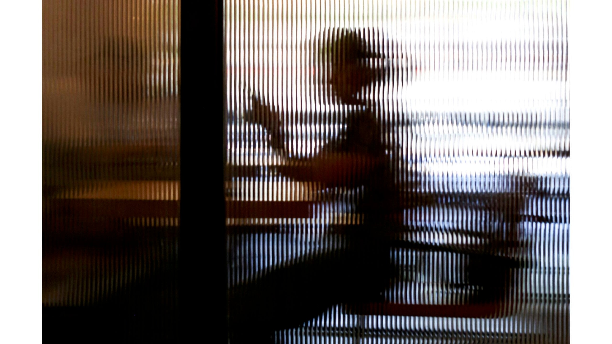 Stressed woman sitting at a desk practicing diaphragmatic breathing