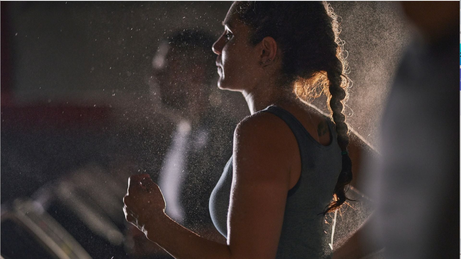 Woman running on a treadmill and not looking happy
