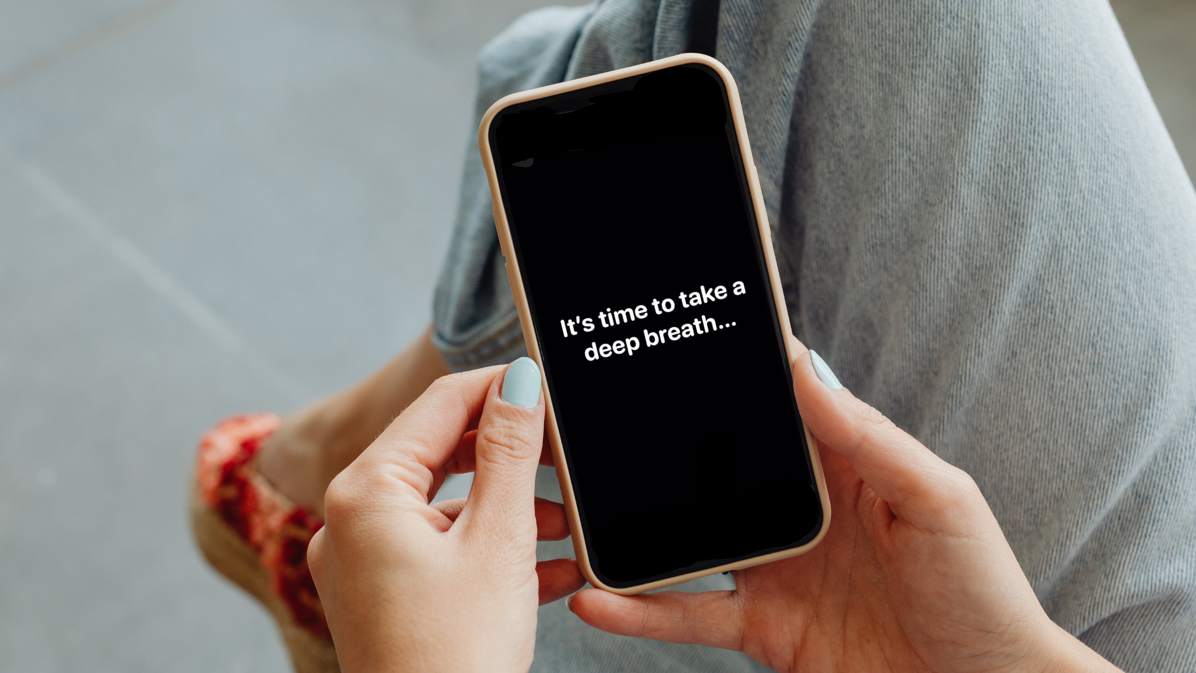 a woman uses the one sec app to take a breath
