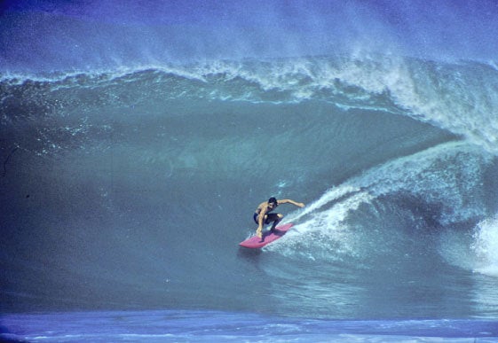 Surfer Gerry Lopez surfs a wave and demonstrates the synergy of yoga and athletes
