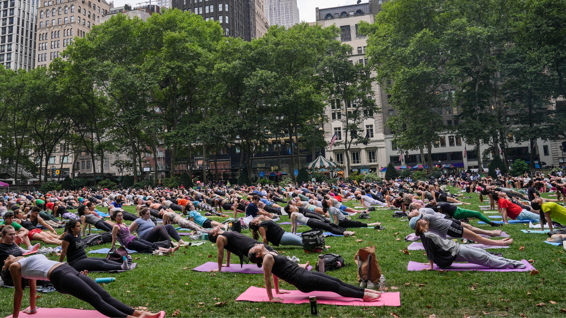 Outdoor yoga class taking place at Bryant Park in New York City