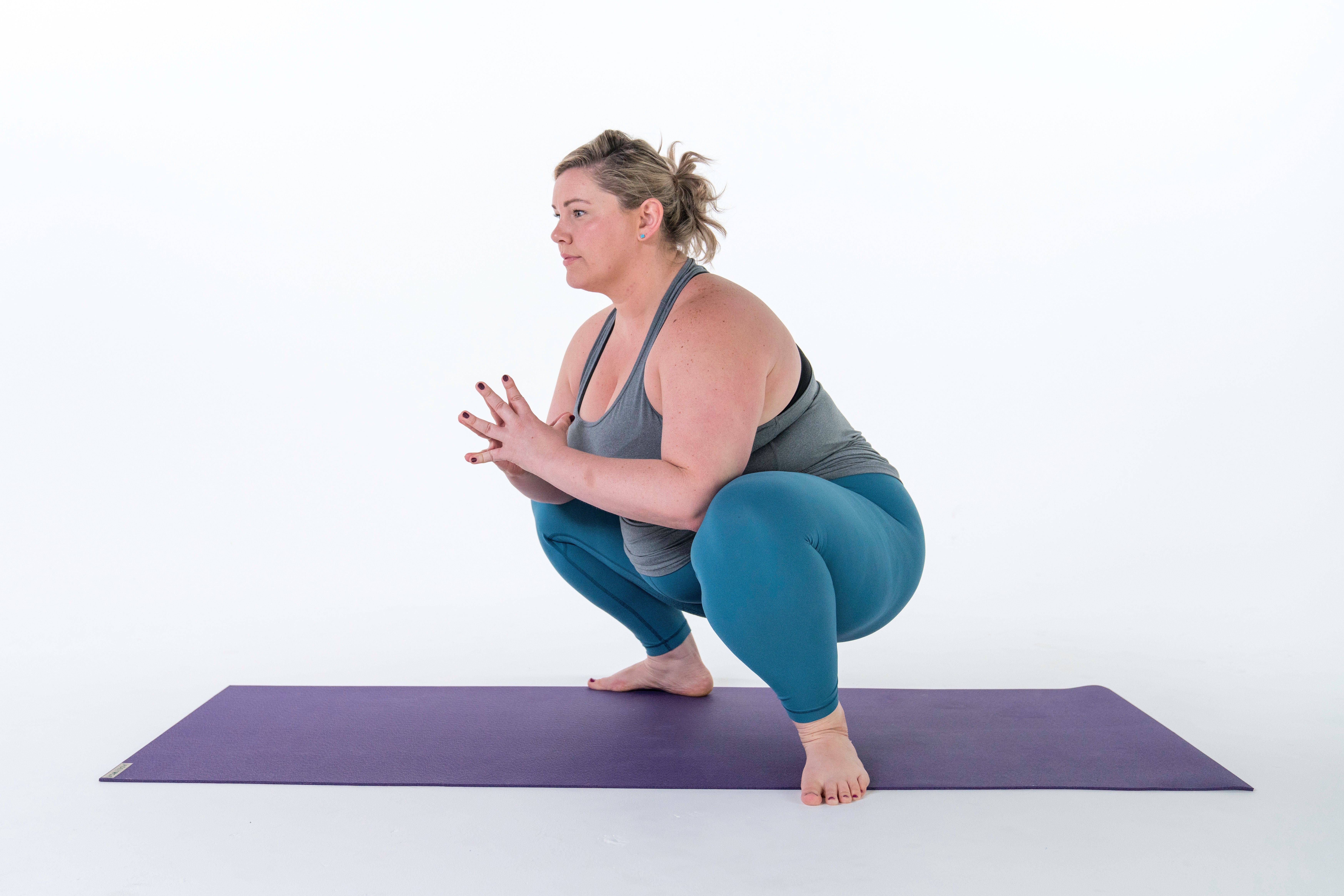 Woman in garland pose